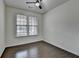 Bright bedroom with hardwood floors and a ceiling fan at 13030 Dartmore Ave, Alpharetta, GA 30005