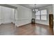 Open dining room with hardwood floors, wainscoting, and ample natural light at 13030 Dartmore Ave, Alpharetta, GA 30005