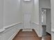 Bright foyer with hardwood floors and elegant wainscoting at 13030 Dartmore Ave, Alpharetta, GA 30005