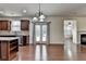 Kitchen seamlessly flows into the dining and living areas at 13030 Dartmore Ave, Alpharetta, GA 30005
