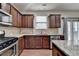 Spacious kitchen with stainless steel appliances, ample counter space, and wood floors at 13030 Dartmore Ave, Alpharetta, GA 30005