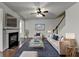 Inviting living room features a cozy fireplace, plush seating, and stylish decor at 13030 Dartmore Ave, Alpharetta, GA 30005