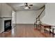 Spacious living room features a fireplace and an elegant wood staircase at 13030 Dartmore Ave, Alpharetta, GA 30005