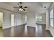 Open bedroom layout with hardwood floors and en suite bathroom at 13030 Dartmore Ave, Alpharetta, GA 30005