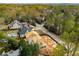Aerial view of a two-story home under construction on a spacious lot in a suburban neighborhood at 1445 West Wesley Ne Rd, Atlanta, GA 30327