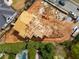 Overhead view of building under construction in neighborhood, next to completed houses and swimming pool at 1445 West Wesley Ne Rd, Atlanta, GA 30327