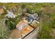Stunning aerial view of new construction home in a lush, tree-lined neighborhood, featuring modern design at 1445 West Wesley Ne Rd, Atlanta, GA 30327