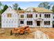 Exterior view of a new home under construction with visible framing and a lift truck at 1445 West Wesley Ne Rd, Atlanta, GA 30327