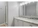 Bathroom with double sinks, granite countertops, and bright vanity lighting at 4811 Westgate Blvd, Atlanta, GA 30349