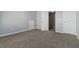 Spacious bedroom features neutral paint, carpet and view of closet at 4811 Westgate Blvd, Atlanta, GA 30349