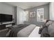 Well-decorated bedroom with a large bed, TV, and modern furnishings for comfortable living at 4811 Westgate Blvd, Atlanta, GA 30349