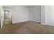 Cozy bedroom features plush carpet, neutral paint, and a closet for ample storage at 4811 Westgate Blvd, Atlanta, GA 30349