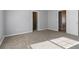 Spacious bedroom features neutral paint and carpet with view of closet and doors at 4811 Westgate Blvd, Atlanta, GA 30349
