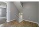 Hallway with wood floors and stairs leading to the second story, with an open doorway at 4811 Westgate Blvd, Atlanta, GA 30349