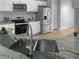 Modern kitchen featuring stainless steel appliances, granite countertops, and a stylish faucet at 4811 Westgate Blvd, Atlanta, GA 30349