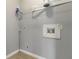 Functional laundry room with shelving and gray walls, ready for your appliances at 4811 Westgate Blvd, Atlanta, GA 30349