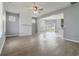 Open concept living room featuring wood flooring, a decorative fireplace and dining area at 4811 Westgate Blvd, Atlanta, GA 30349