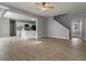 Spacious and airy living room with modern flooring and access to the kitchen and staircase at 4811 Westgate Blvd, Atlanta, GA 30349