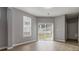 Spacious living room with hardwood floors and sliding glass door at 4811 Westgate Blvd, Atlanta, GA 30349