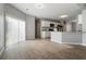 Open-concept living area showcases seamless flow to the kitchen and a sliding glass door at 4811 Westgate Blvd, Atlanta, GA 30349