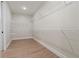 Spacious walk-in closet features white wire shelving and wood-look flooring at 510 Price Rd, Carrollton, GA 30116