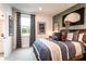 Stylish bedroom with a basketball theme, window, and accent wall at 5109 Hillside Haven Dr, Powder Springs, GA 30127