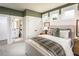 Cozy bedroom with ensuite bathroom featuring an array of windows and a walk in closet at 5109 Hillside Haven Dr, Powder Springs, GA 30127