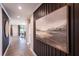 Elegant hallway featuring art decor and a view of the home's open floor plan at 5109 Hillside Haven Dr, Powder Springs, GA 30127