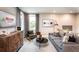 Cozy loft featuring a comfortable sofa and a TV, perfect for relaxation at 5109 Hillside Haven Dr, Powder Springs, GA 30127