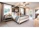Stylish main bedroom featuring a four-poster bed and an adjacent outdoor deck at 5109 Hillside Haven Dr, Powder Springs, GA 30127