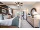 Bright main bedroom with four-poster bed, natural light, and access to balcony at 5109 Hillside Haven Dr, Powder Springs, GA 30127