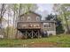 Exterior view of home featuring a deck, backyard, and outdoor space at 5415 Keithwood Dr, Cumming, GA 30040