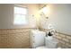 Bathroom with vanity sink and decorative tiled walls at 5415 Keithwood Dr, Cumming, GA 30040