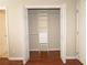 Bedroom closet with open doors and built-in shelving and drawers at 5415 Keithwood Dr, Cumming, GA 30040