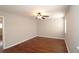 Spacious bedroom with hardwood floors, a ceiling fan, and ample natural light at 5415 Keithwood Dr, Cumming, GA 30040