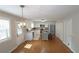 Bright, open kitchen featuring white cabinets, stainless steel appliances, and a central island at 5415 Keithwood Dr, Cumming, GA 30040