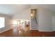 An open-concept view of the living room, stairs and kitchen at 5415 Keithwood Dr, Cumming, GA 30040