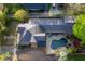 Aerial view of home with pool and lush landscaping, offering a private backyard oasis at 176 Stewart Nw Ave, Marietta, GA 30064
