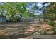 Spacious backyard with stone path, trellis and mature trees. Perfect for outdoor entertaining and relaxing at 176 Stewart Nw Ave, Marietta, GA 30064