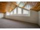Lofted carpeted bonus room featuring 3 angled windows and a wood ceiling at 176 Stewart Nw Ave, Marietta, GA 30064