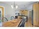 Open concept: Dining room view to a stainless steel kitchen with wood cabinetry at 176 Stewart Nw Ave, Marietta, GA 30064