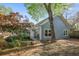 Exterior view of home with sliding doors, trees, and landscaping at 176 Stewart Nw Ave, Marietta, GA 30064