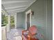 Relaxing front porch featuring an Adirondack chair, offering a cozy spot to enjoy the peaceful surroundings at 176 Stewart Nw Ave, Marietta, GA 30064