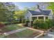 Charming home with landscaped front yard and walkway at 176 Stewart Nw Ave, Marietta, GA 30064
