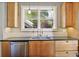 Updated kitchen with a stainless dishwasher and sink under a large window at 176 Stewart Nw Ave, Marietta, GA 30064
