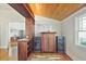 Stylish living space featuring custom bar with wood ceiling, hardwood floors, and ample natural light at 176 Stewart Nw Ave, Marietta, GA 30064