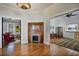 Cozy living room featuring a fireplace, hardwood flooring, and an open layout connecting to multiple rooms for easy flow at 176 Stewart Nw Ave, Marietta, GA 30064