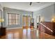 Spacious main bedroom with two windows, dresser, wood floors, and a bathroom at 176 Stewart Nw Ave, Marietta, GA 30064