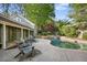 Backyard pool with waterfall feature and gray lounge chairs overlooking a lush backyard at 176 Stewart Nw Ave, Marietta, GA 30064