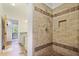 Custom tiled shower with a built in shelf and neutral colored tile design at 176 Stewart Nw Ave, Marietta, GA 30064